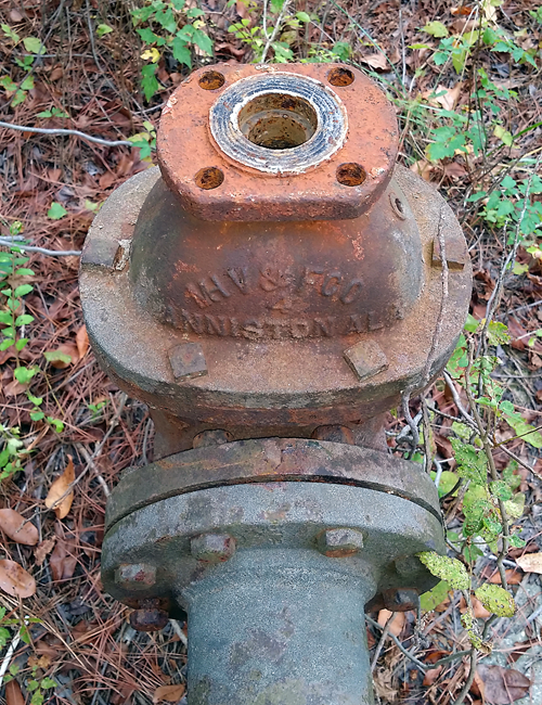 Remnant mains and couplings, lettering reveals that they were forged in nearby Alabama.